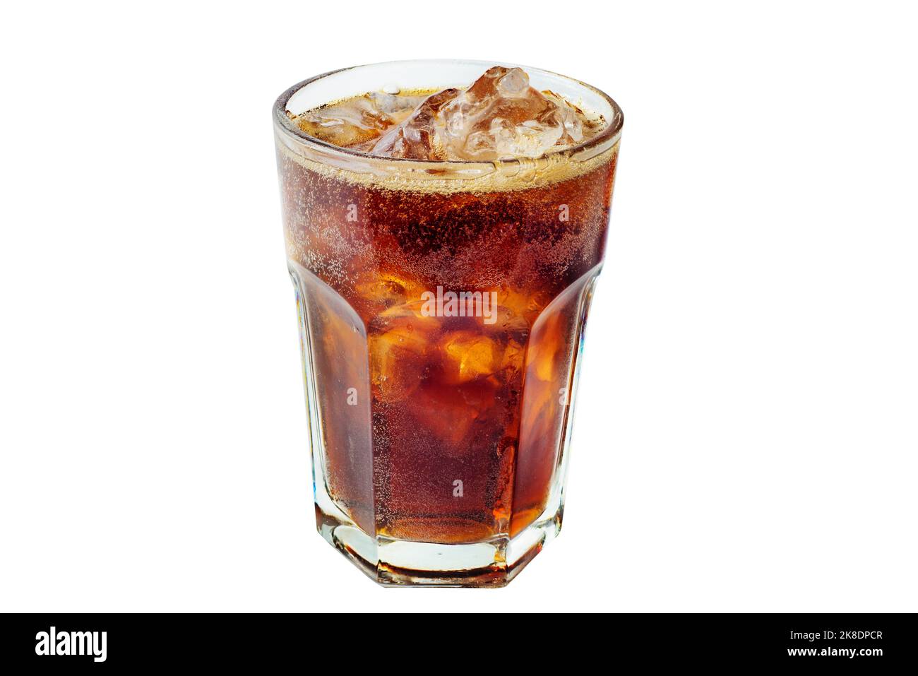 Cola with ice in a glass. Beautiful foam and air bubbles in a sweet carbonated drink Stock Photo