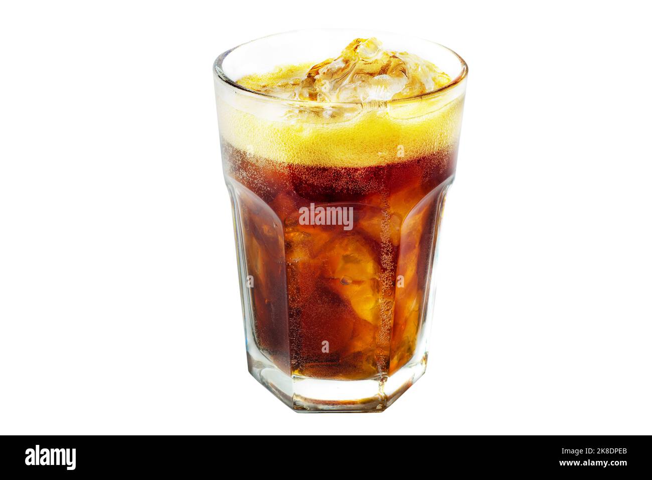 Cola with ice in a glass. Foam and air bubbles in a sweet carbonated drink. Glass carbonated beverage and ice Stock Photo