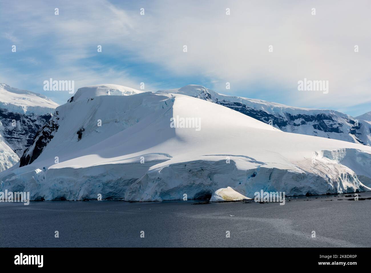felice point at southern tip of lion island at entrance to neumayer channel from gerlache strait. with anvers island in background. antarctic peninsul Stock Photo