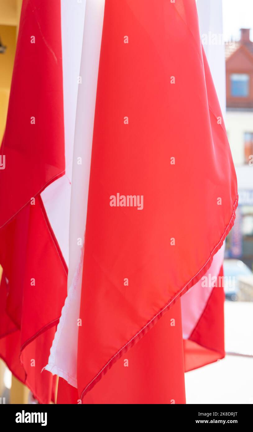 Red and white flags set close together. Symbol and Polish national