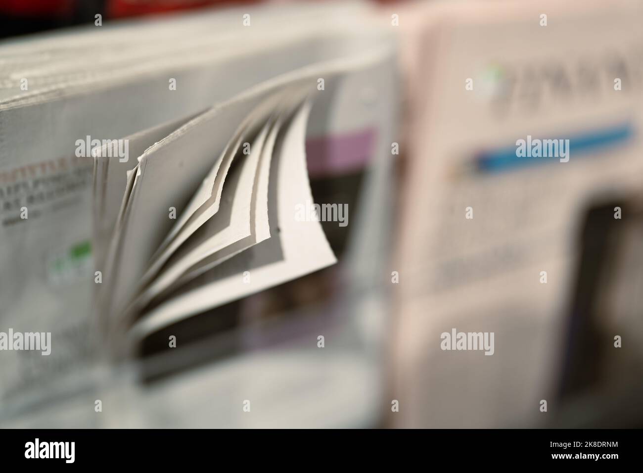 Newspaper on a News stand Stock Photo - Alamy