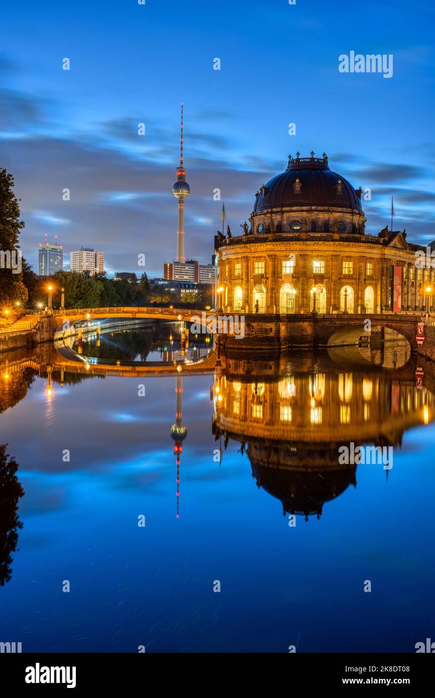 The Bode-Museum and the Television Tower reflected in the river Spree in Berlin at night Stock Photo