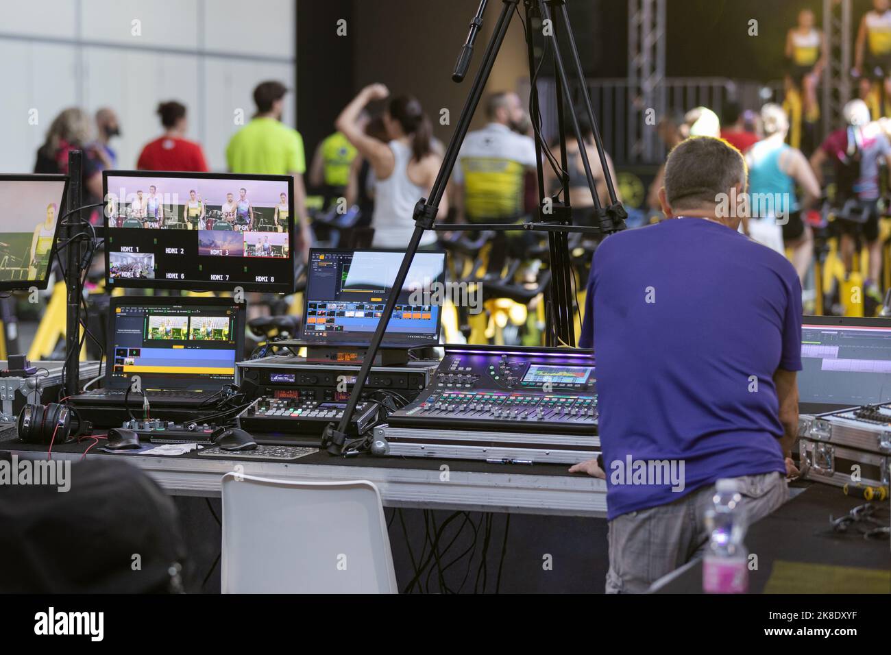 Lighting and Sound Technician and Broadcast Operator at Work in the