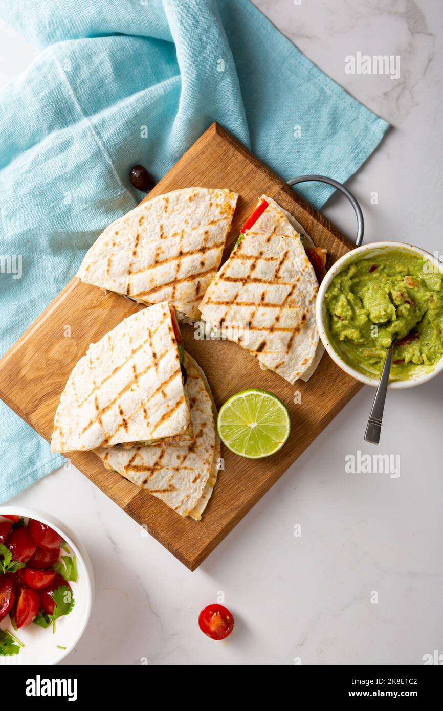 Close up of grilled tortilla with meat salsa guacamole top view food Stock Photo