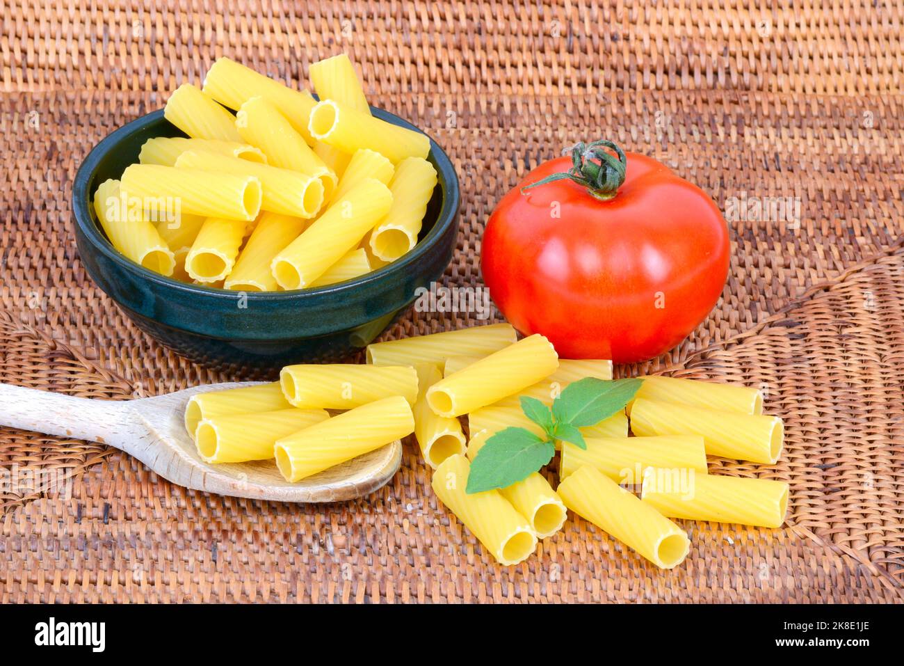 Italian pasta, rigatoni, pasta, noodles, tomato, basil Stock Photo