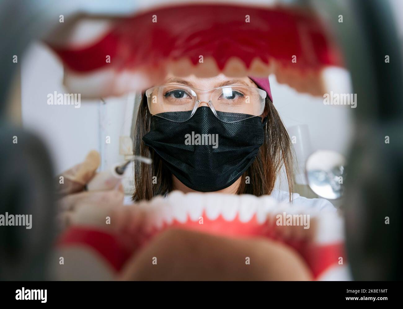 Woman dentist cleaning a mouth inside view, Inside view of a mouth