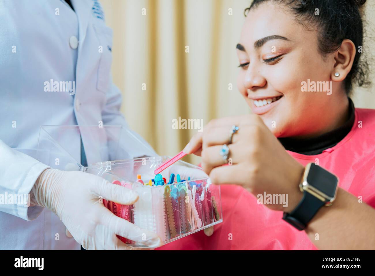 Dental patient choosing dental braces, Patient with dentist choosing