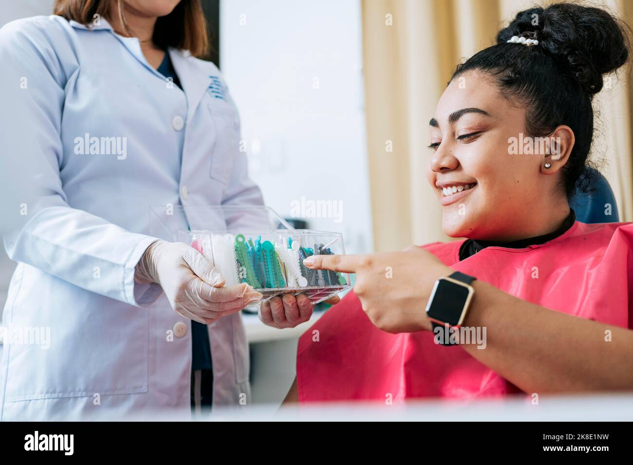 Dental patient choosing dental braces, Patient with dentist choosing