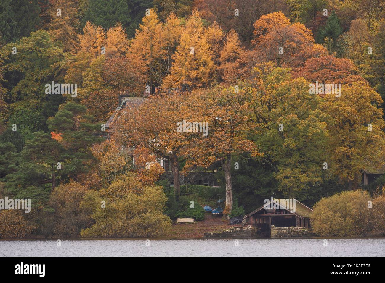 Epic landscape image of boathouse on Derwentwater in Lake District