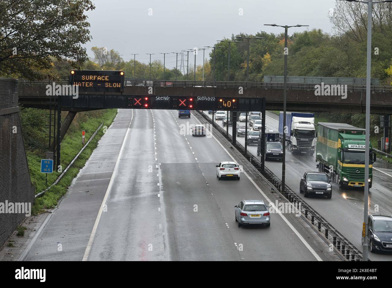 Quinton, Birmingham, October 23rd 2022. - Lanes 1 and 2 (of 3) are closed on the M5 Southbound between J2 Oldbury and J3 Quinton due to flooding following heavy rainfall. Workmen try to free the flow of water. Torrential rain has hit many parts of Birmingham on Sunday. Pic by Credit: Stop Press Media/Alamy Live News Stock Photo