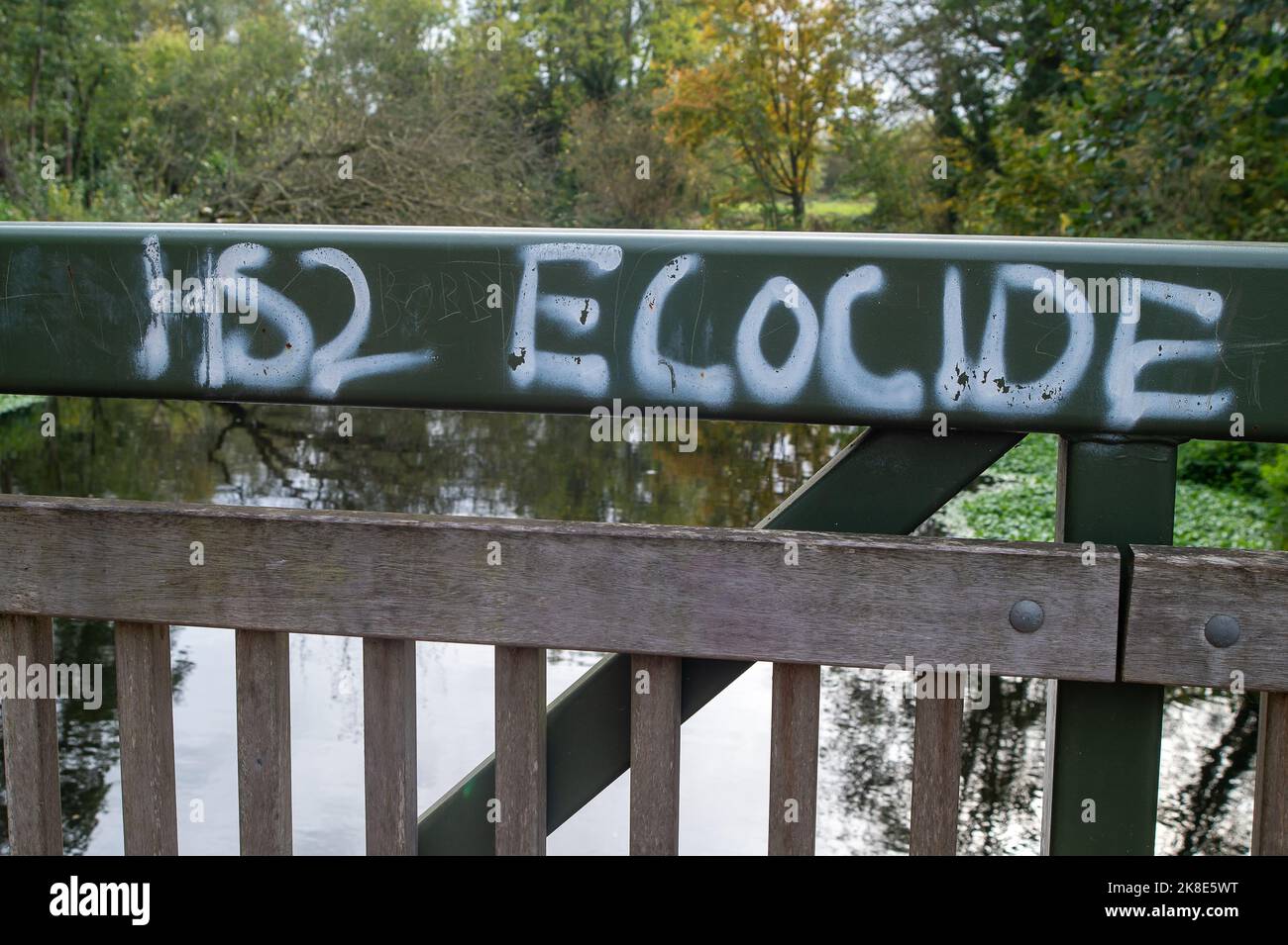Denham, Uxbridge, UK. 22nd October, 2022. HS2 Ecocide graffiti on a bridge in the Colne Valley Park where HS2 have destroyed a large of trees as part of the High Speed 2 Rail project. Phase 1 of the HS2 project is reported to be vastly over budget and the Treasury  have asked for a financial review to take place. Environmentalists are continuing their fight to get HS2 to be cancelled. Credit: Maureen McLean/Alamy Live News Stock Photo