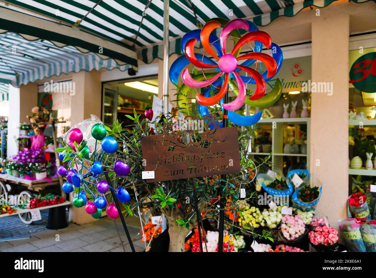 Flower shop in shopping street, decorative items for the garden