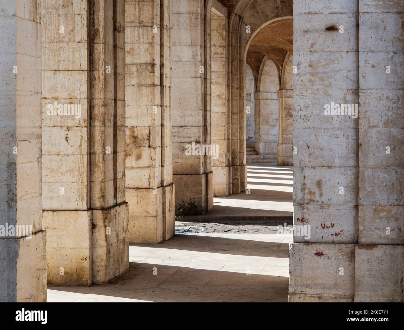 Stone arches in the corridors of the palace of Aranjuez Stock Photo