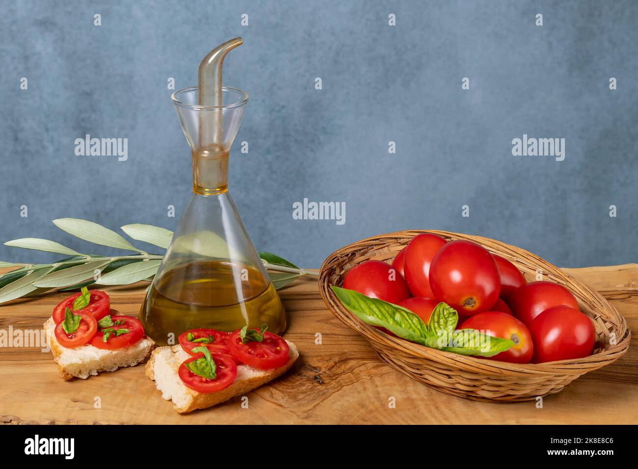 Typical Italian bruschetta, prepared with toasted bread, extra virgin olive oil, salt and basil Stock Photo