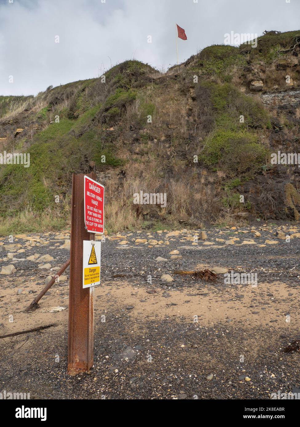 Sign and red flag warning, Kimmeridge Bay, dorset Stock Photo
