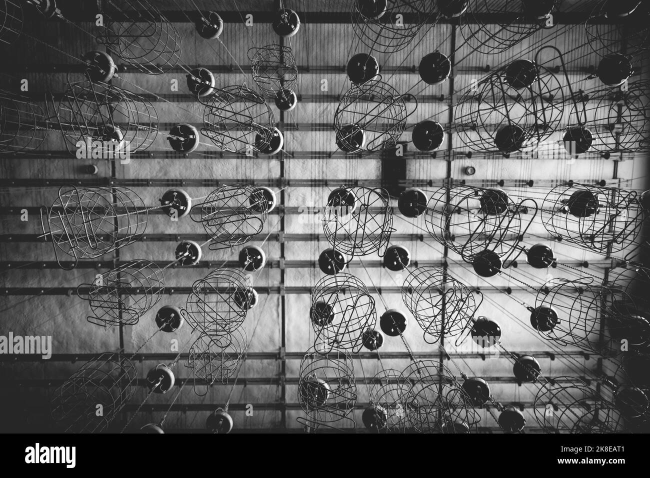 Wire baskets hang under the ceiling. Here the miners have hung their clothes to dry Stock Photo