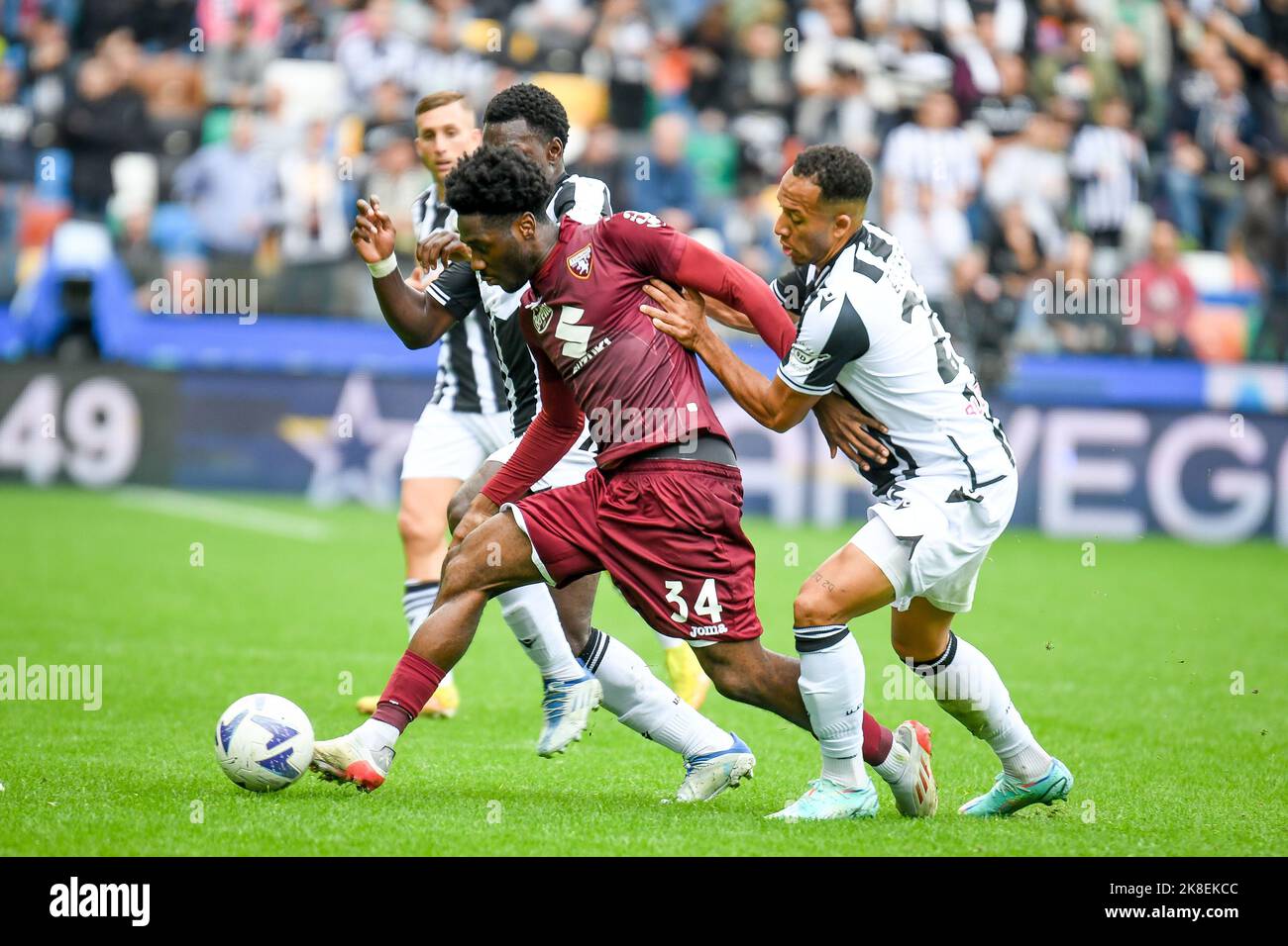 Torino's Ola Aina hindered by Udinese's Enzo Ebosse during the italian