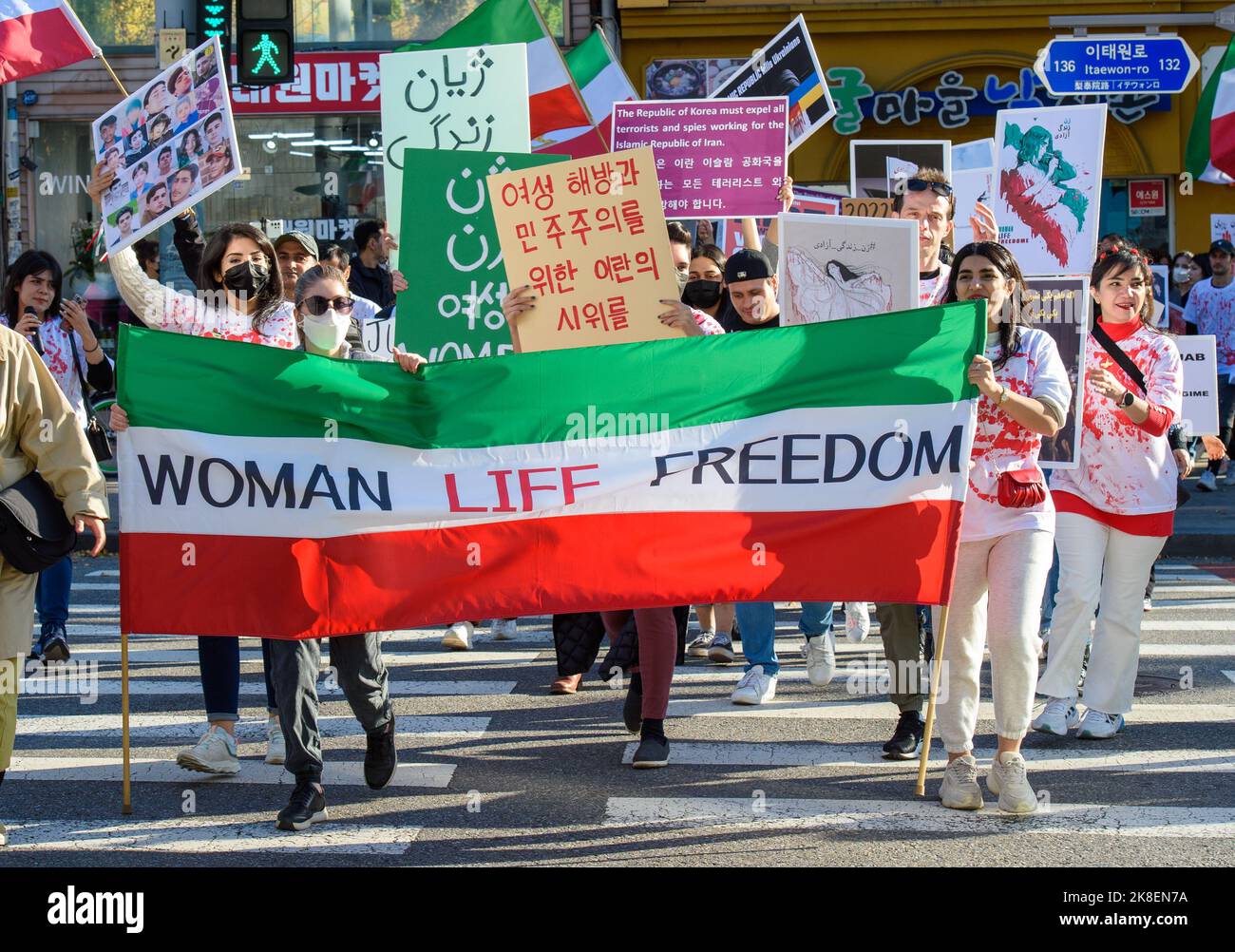 iranians-hold-a-banner-and-placards-expressing-their-opinion-during-the