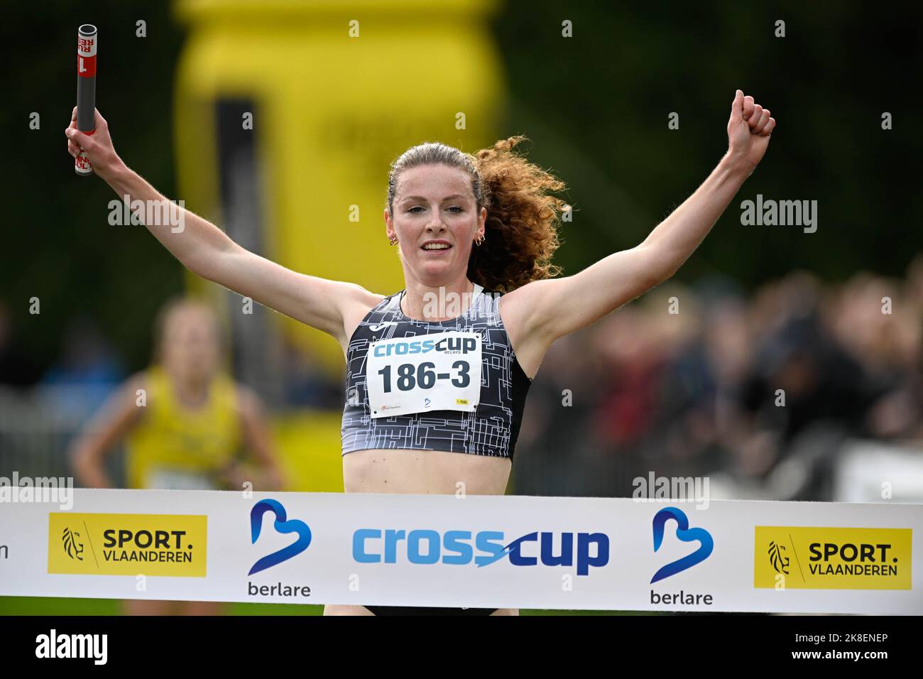 Belgian Lisa Rooms celebrates as she crosses the finish line to win the ...
