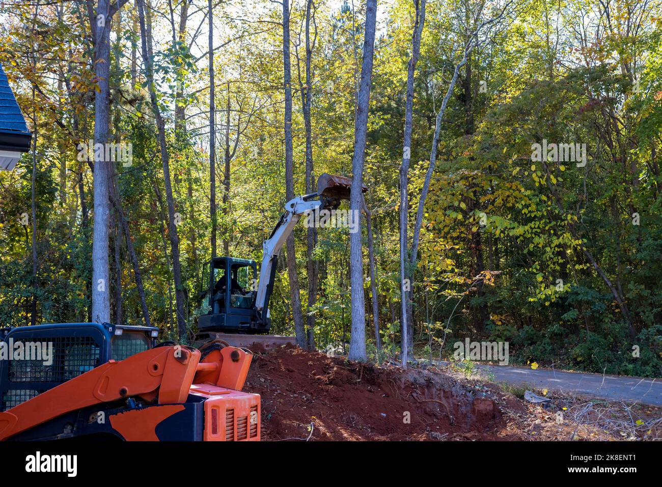 Clear land for construction of new housing development, tractor skid