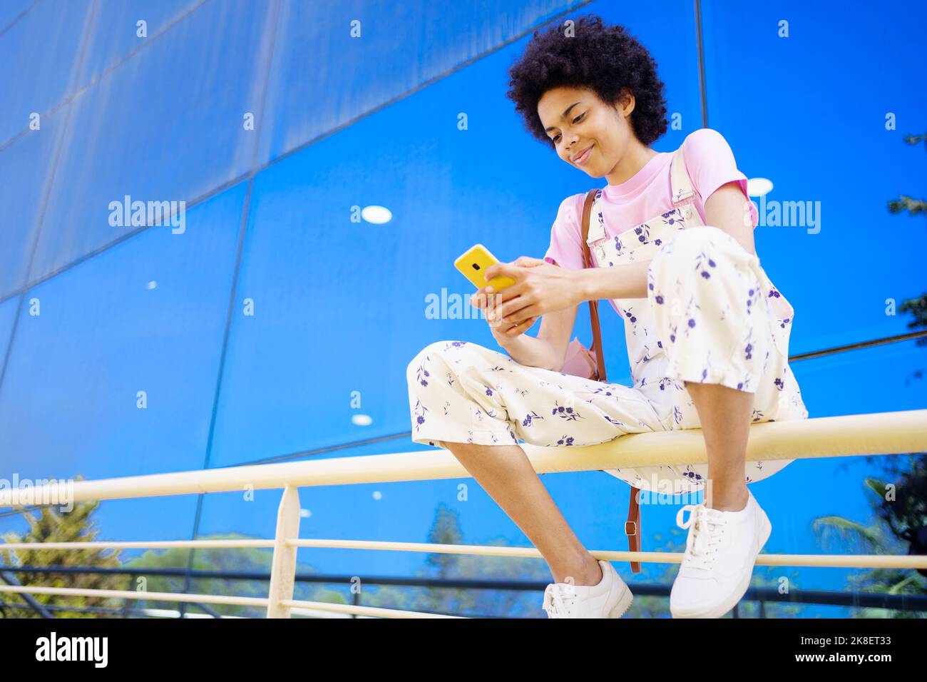 Woman texting message on street hi-res stock photography and images - Alamy