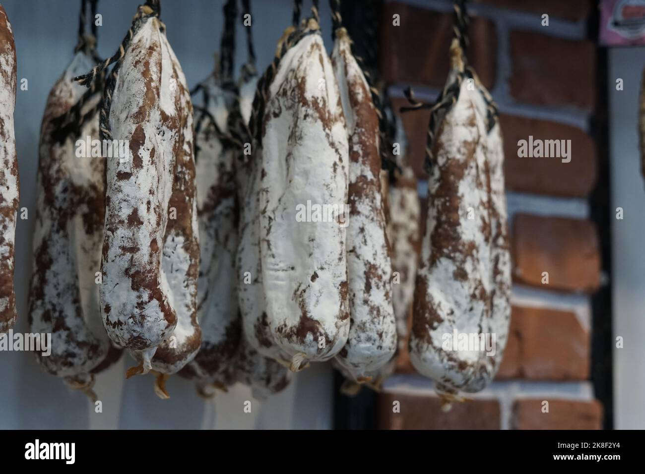 Dried Salami hanging in a shop Stock Photo Alamy