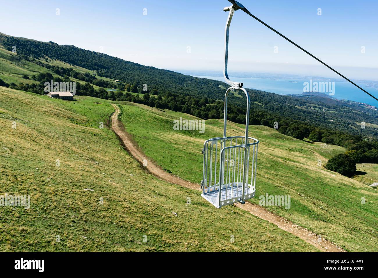 Ski lift hanging from cable at Monte Baldo Stock Photo