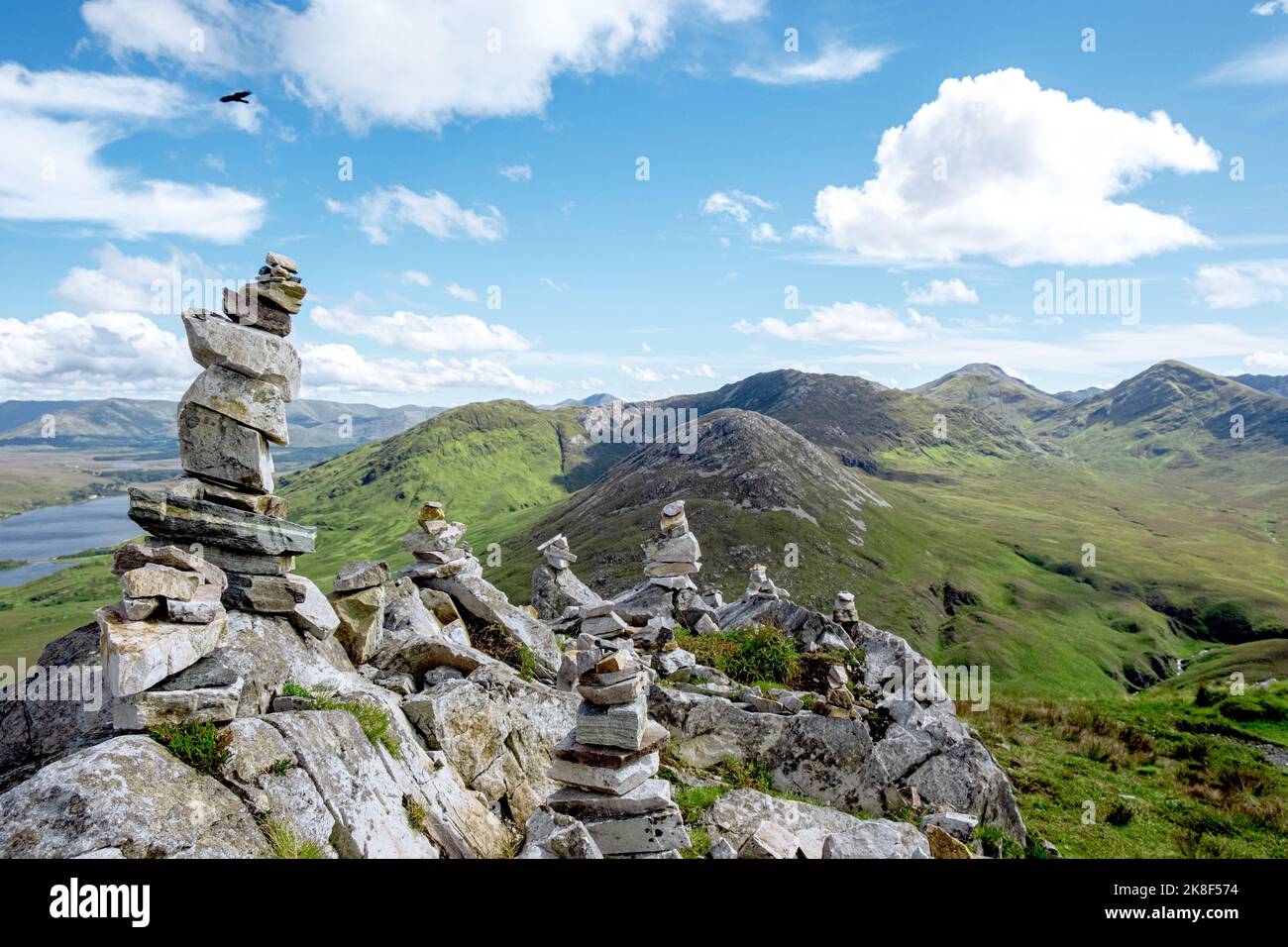 Stone Towers in Connemara National Park with beautiful mountains in the background, county