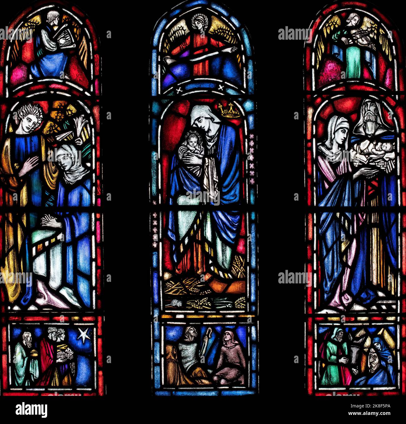 The 'Annunciation', 'Virgin and Child' and 'Presentation in the Temple' window by Kemp and Chilton (1934), St Cuthbert's Church, Milburn, Cumbria, UK Stock Photo