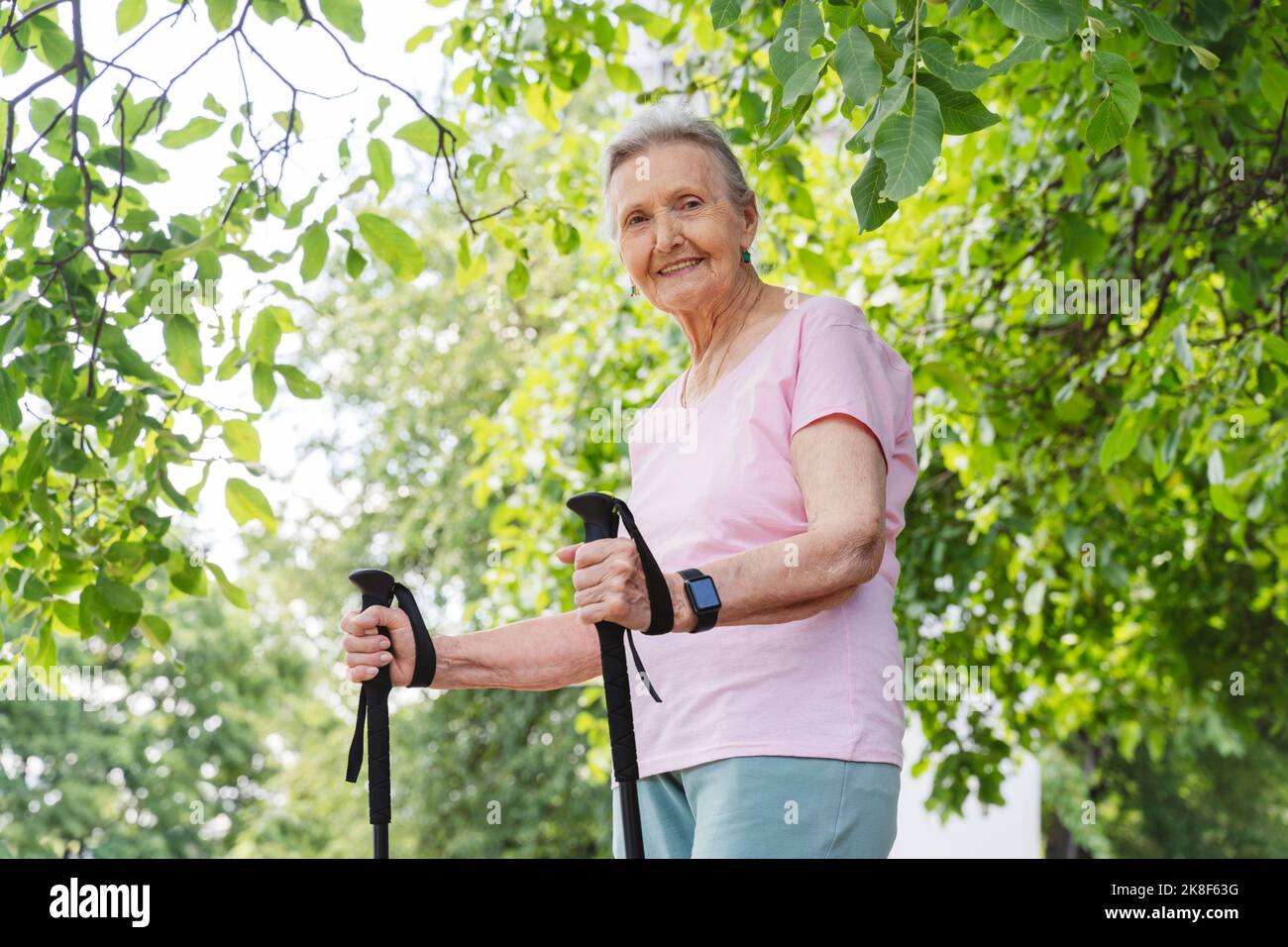 Happy woman walking stick hi-res stock photography and images - Alamy