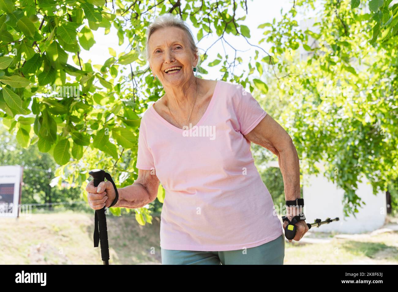 Happy woman walking stick hi-res stock photography and images - Alamy