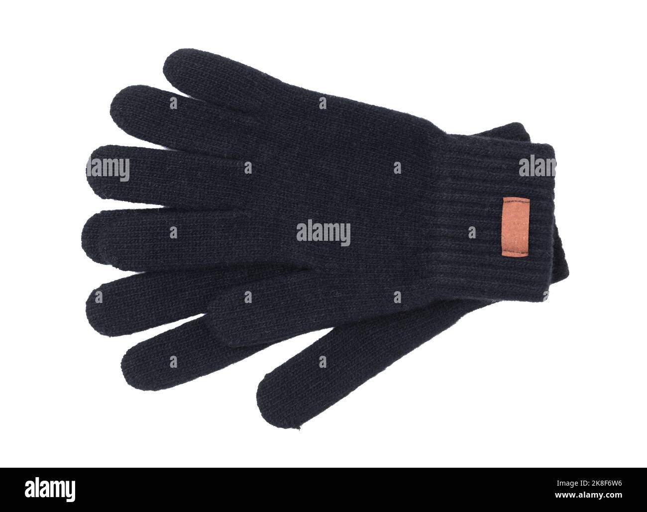 Pair of black wool gloves isolated on white. Top view. Stock Photo