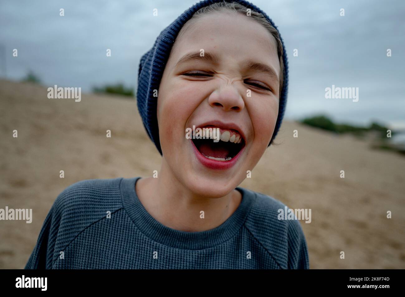 Happy boy wearing knit hat Stock Photo