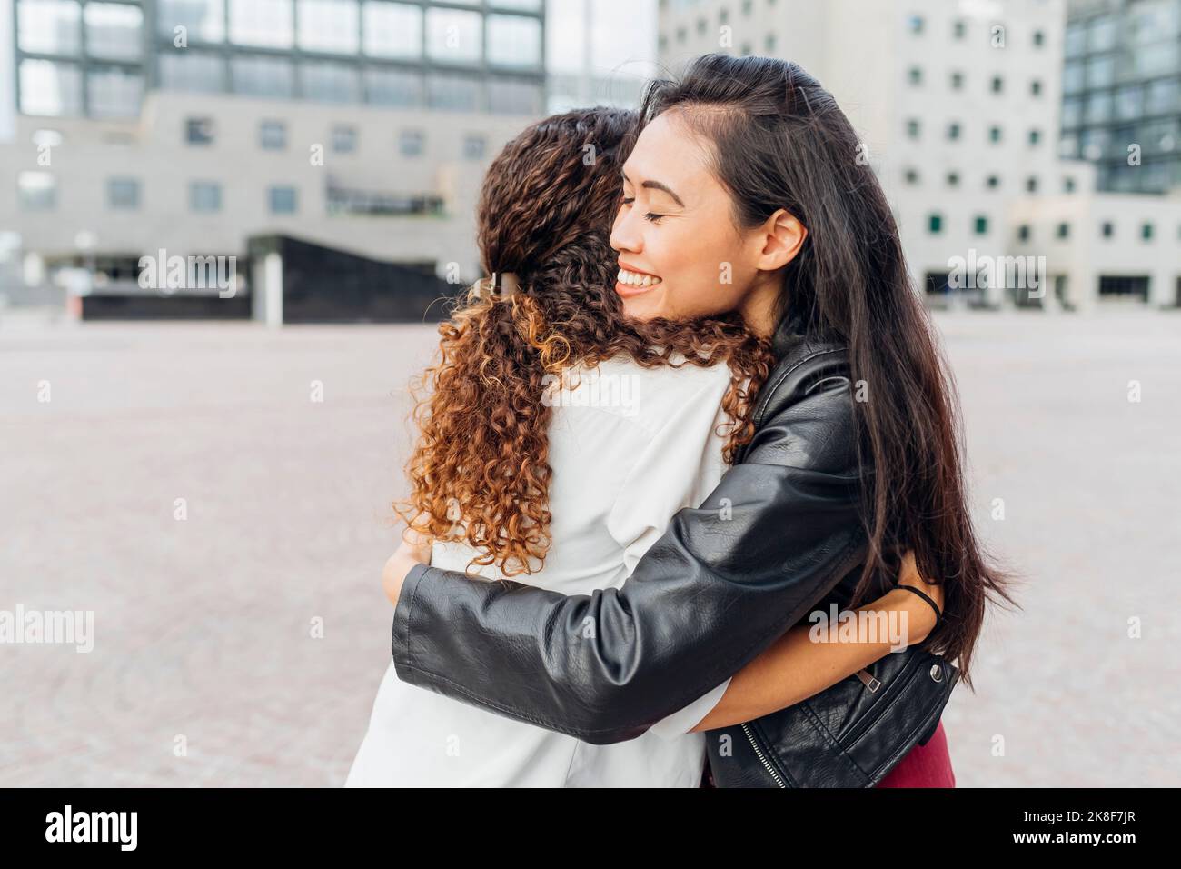 Group hugging mixed ethnicity hi-res stock photography and images - Alamy