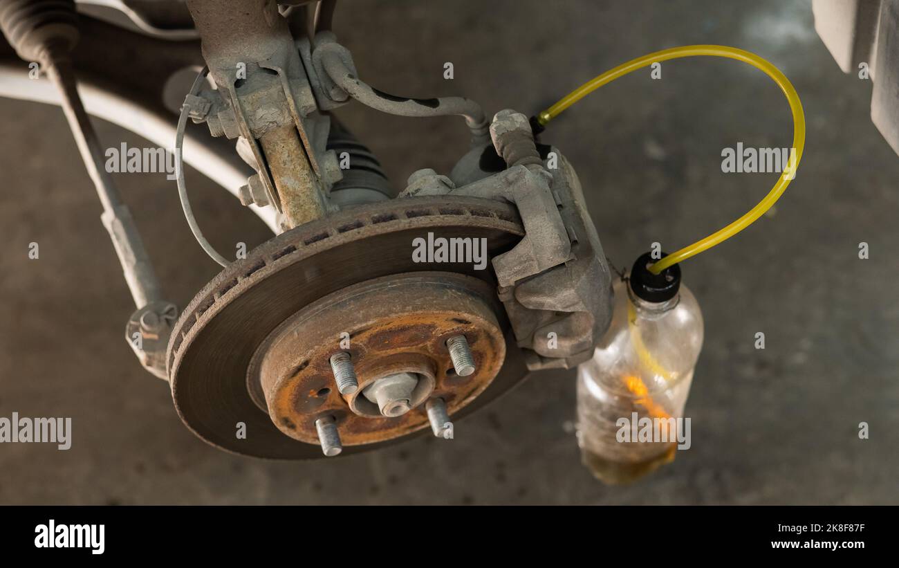 Automatic change of brake fluid in a car service Stock Photo Alamy