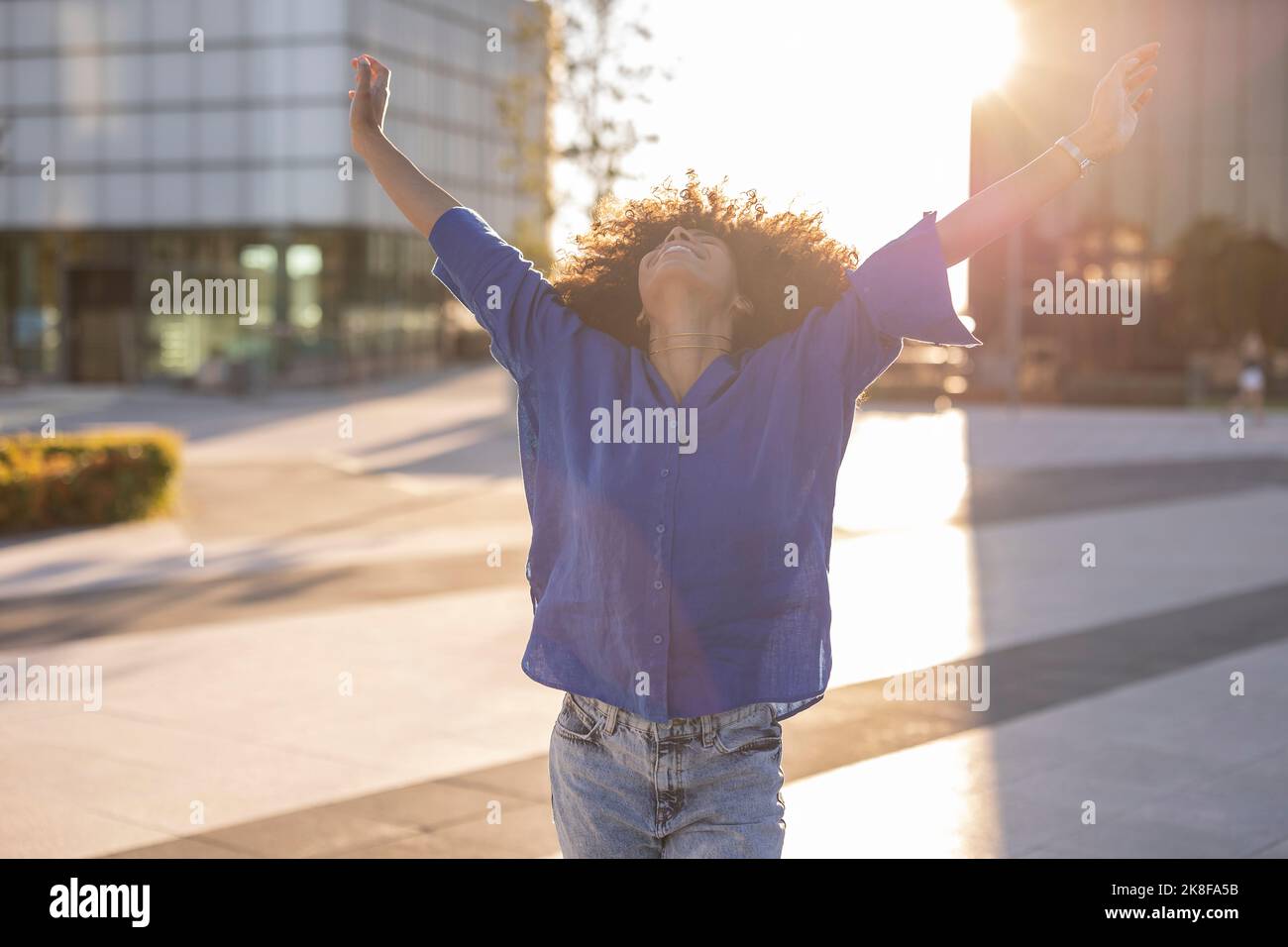African american woman raising arms hi-res stock photography and images ...