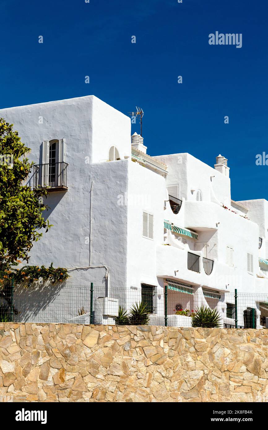 Moorish style whitewashed houses along Playa de la Barrosa, Costa de la Luz, Spain Stock Photo