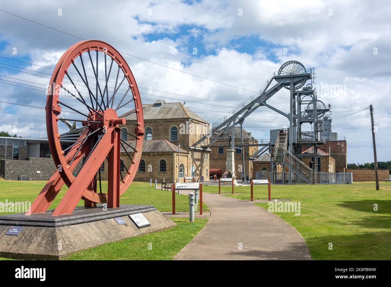 Pit Wheel and mine shafts at entrance to Woodhorn Museum, QE Country Park, Ashington, Northumberland, England, United Kingdom Stock Photo