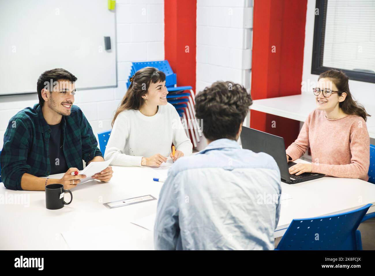 Smiling business colleagues in office meeting Stock Photo