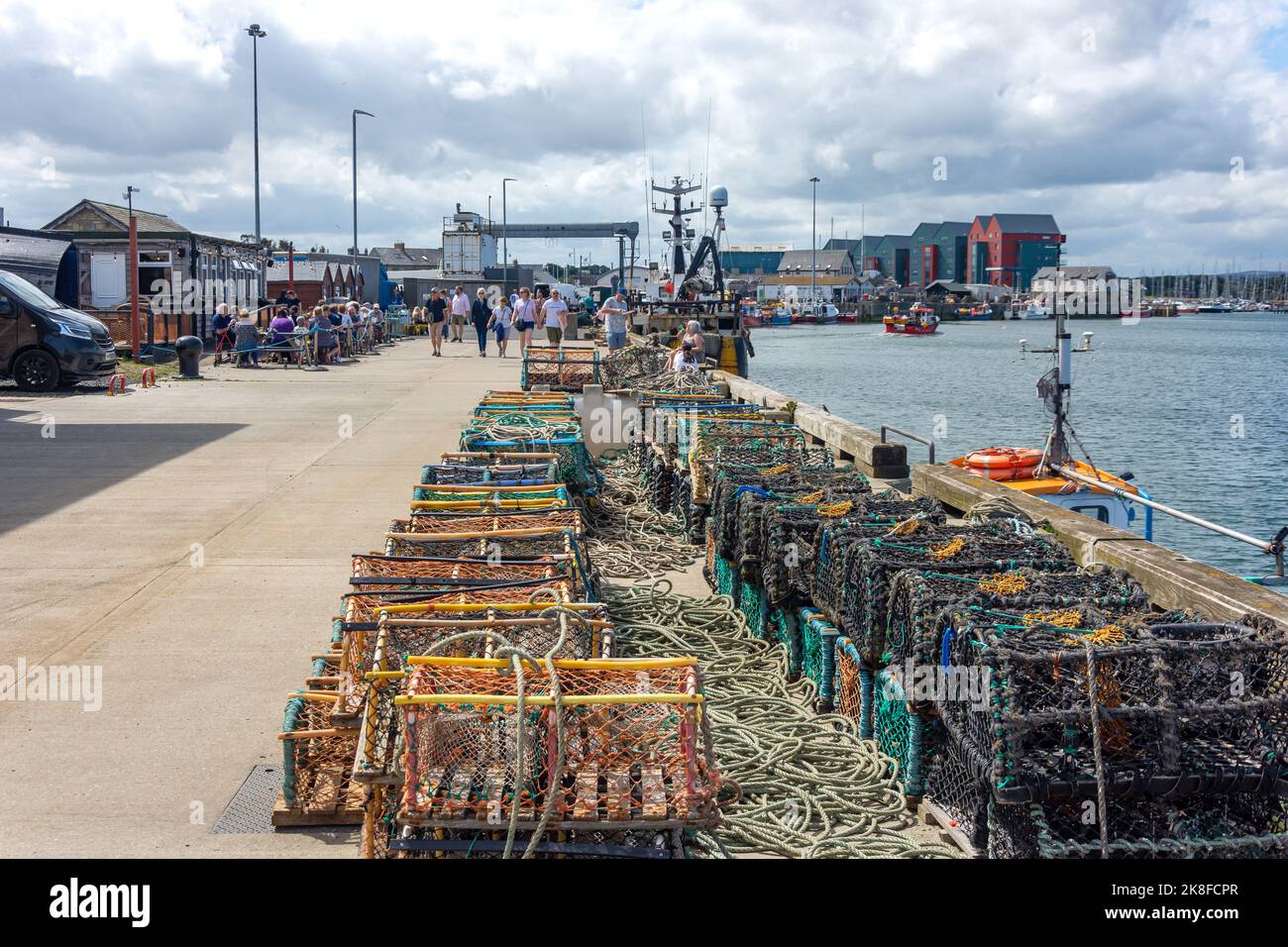 Lobster pots on Amble Quayside, Harbour Road, Amble, Northumberland, England, United Kingdom Stock Photo