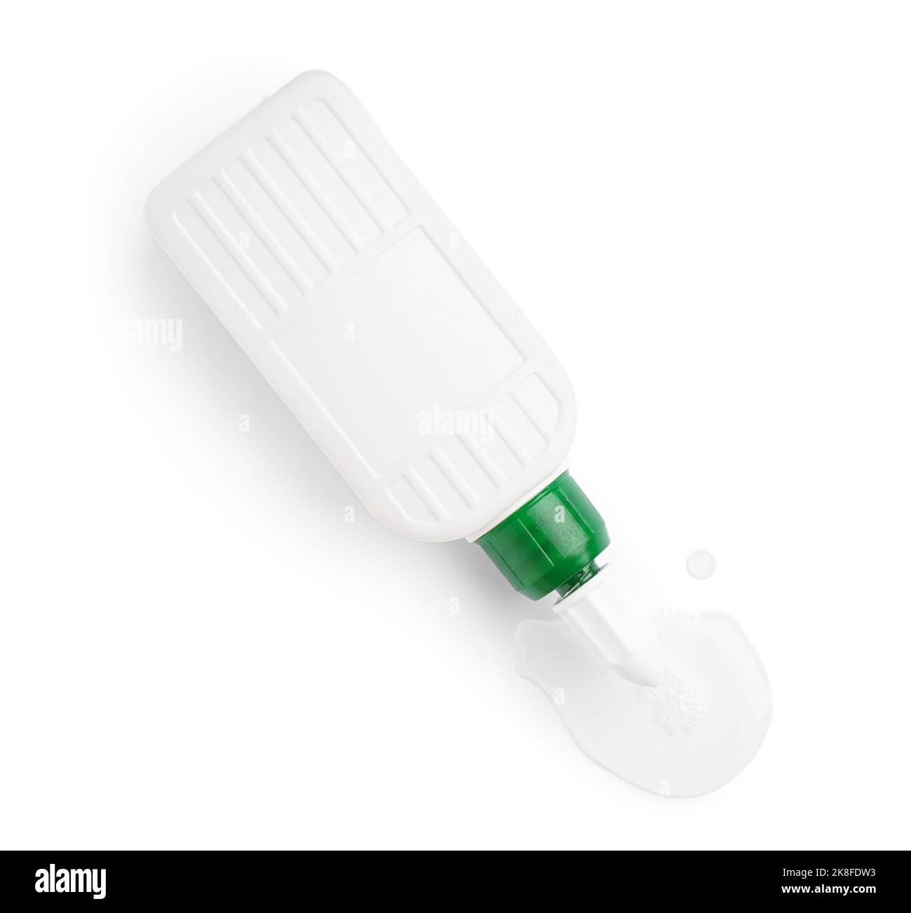Bottle with spilled glue on white background Stock Photo - Alamy