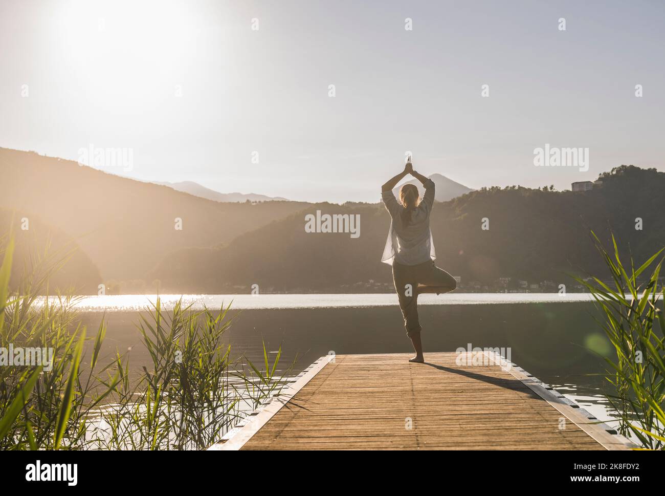 Mature woman in tree pose hi-res stock photography and images - Alamy