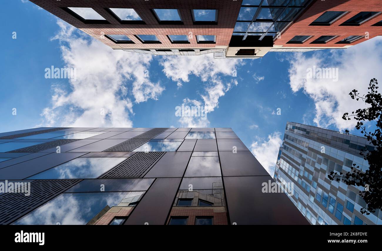 Modern skyscrapers under cloudy sky Stock Photo - Alamy