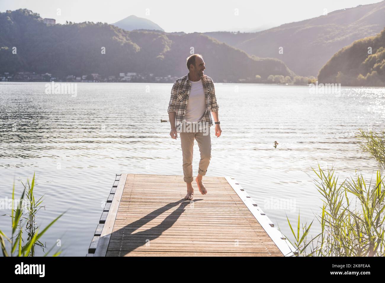 Man walking on jetty hi-res stock photography and images - Alamy