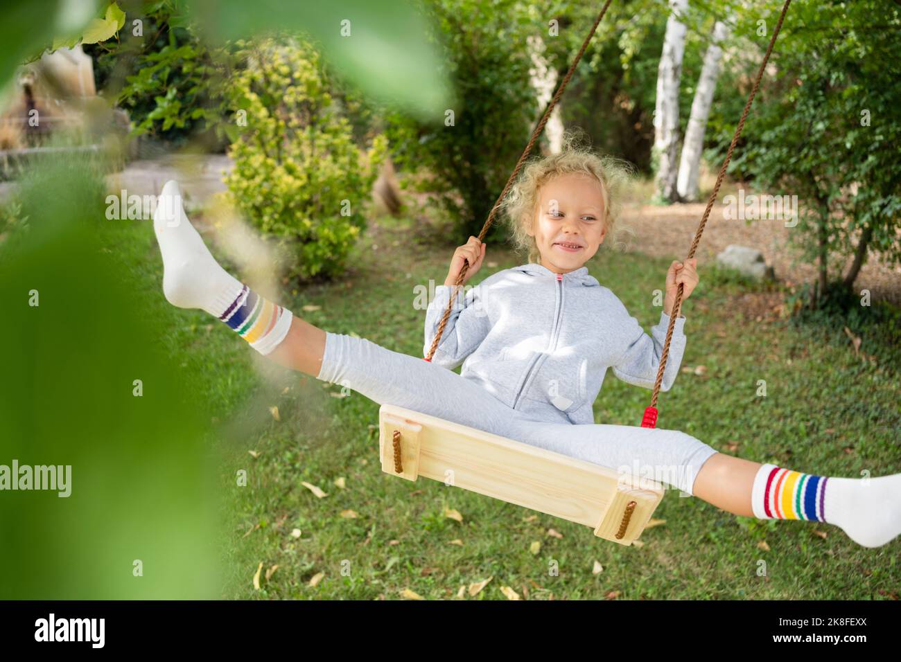Child swinging legs hires stock photography and images Alamy