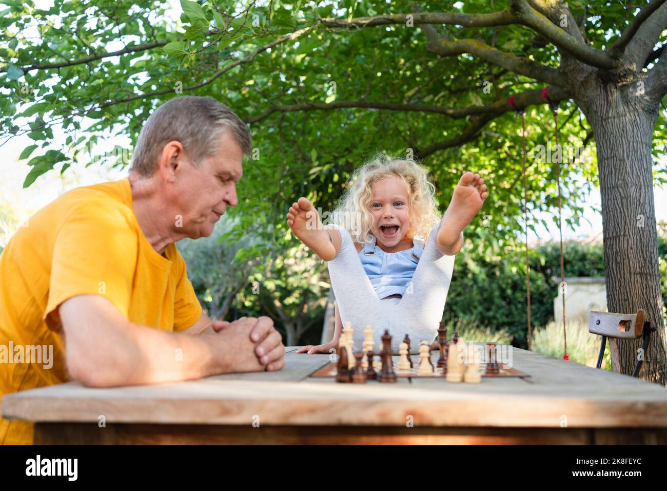 Teenager Playing Chess with his Grandfather · Free Stock Photo