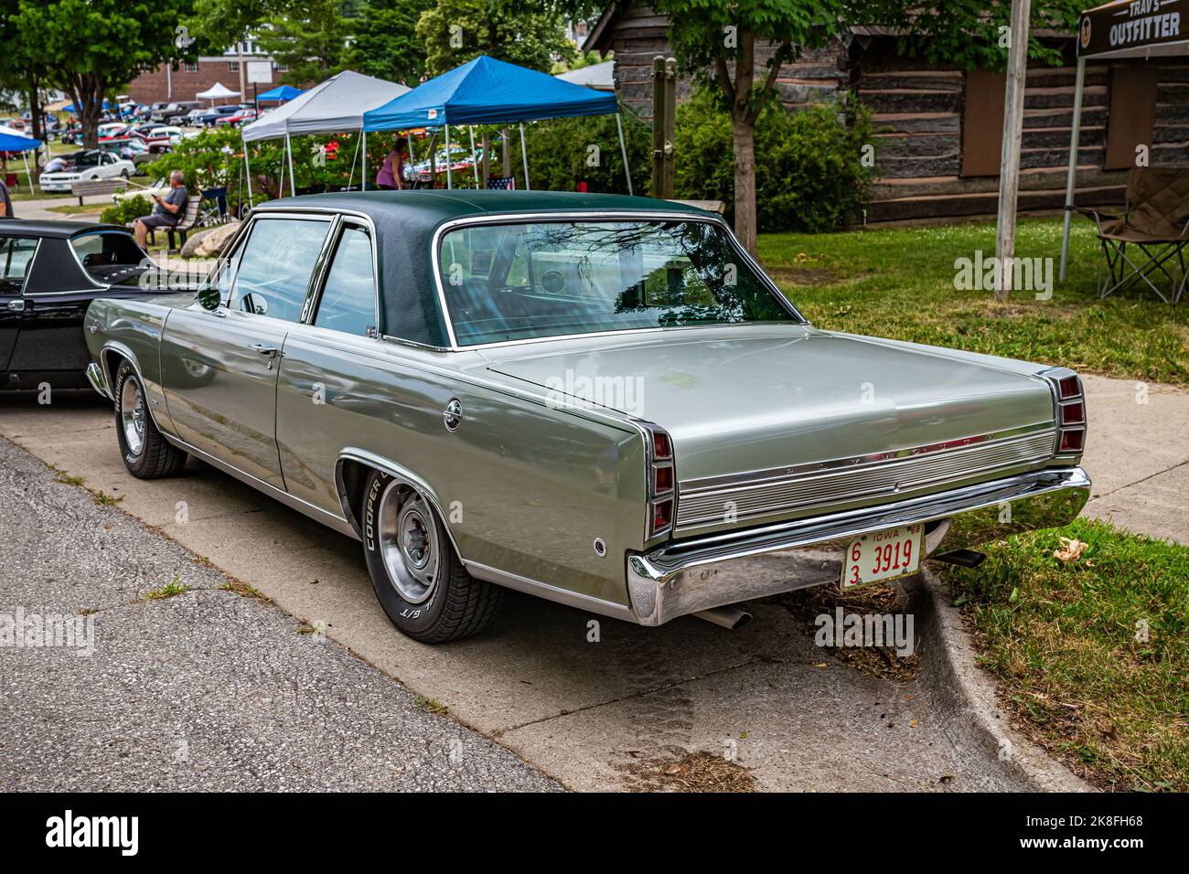 Des Moines, IA - July 01, 2022: High perspective rear corner view of a 1968 Plymouth Valiant Signet 2 Door Sedan at a local car show. Stock Photo