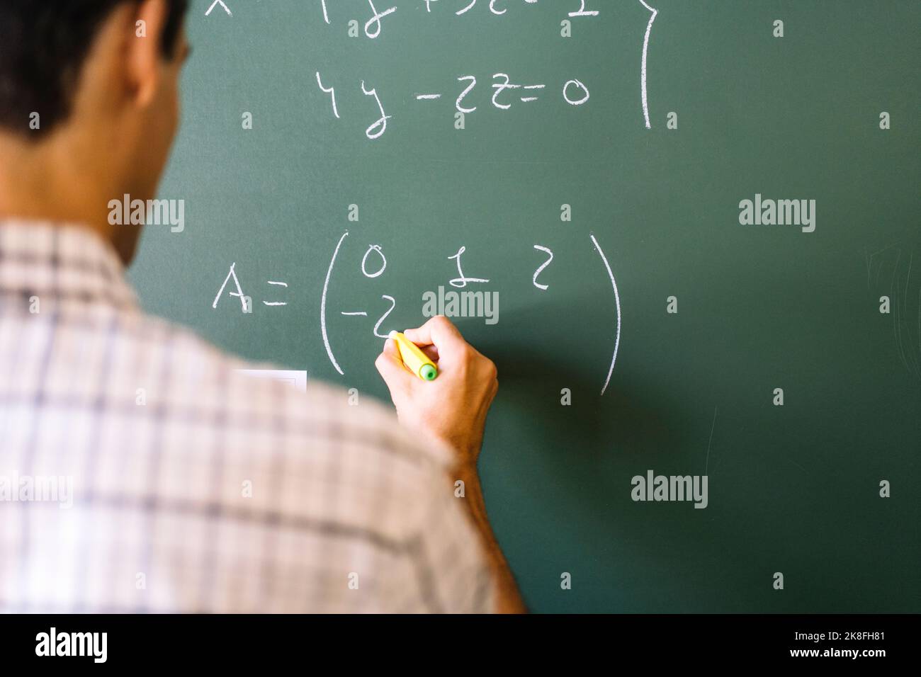 math-teacher-solving-problems-on-chalkboard-stock-photo-alamy