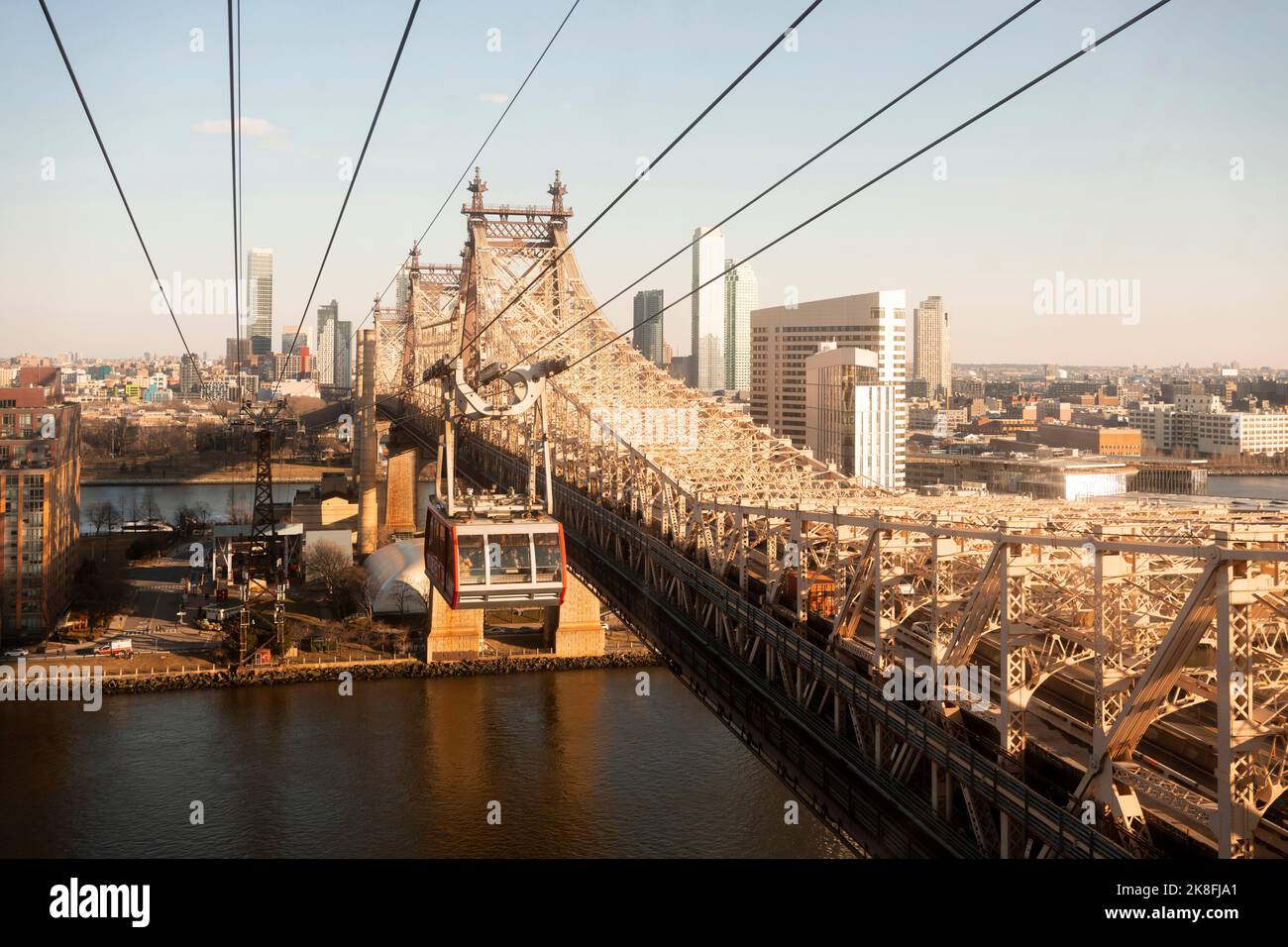 USA, New York, New York City, Overhead Cable Car moving along Queensboro Bridge at dusk Stock Photo