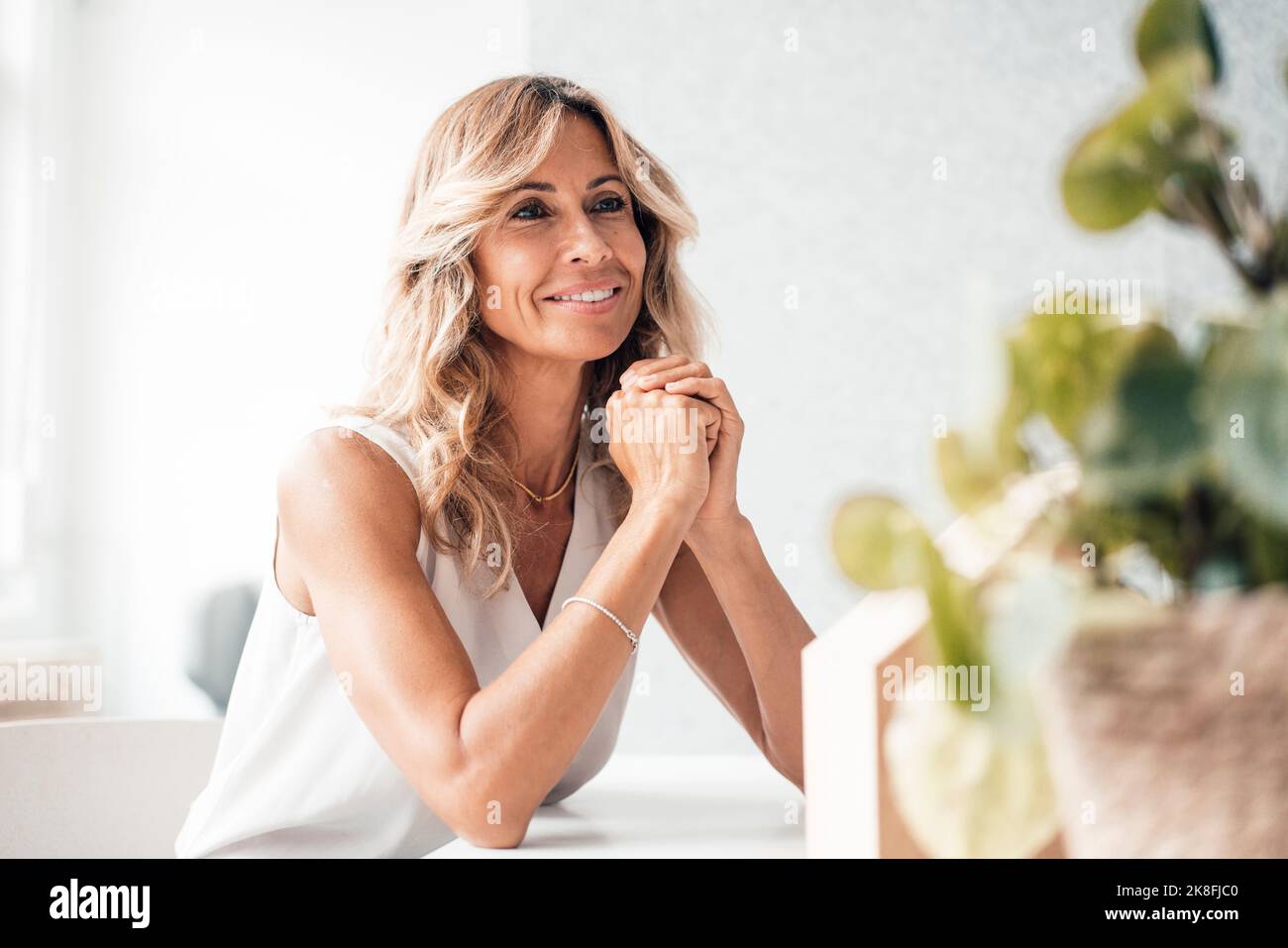 Contemplative architect smiling at office Stock Photo